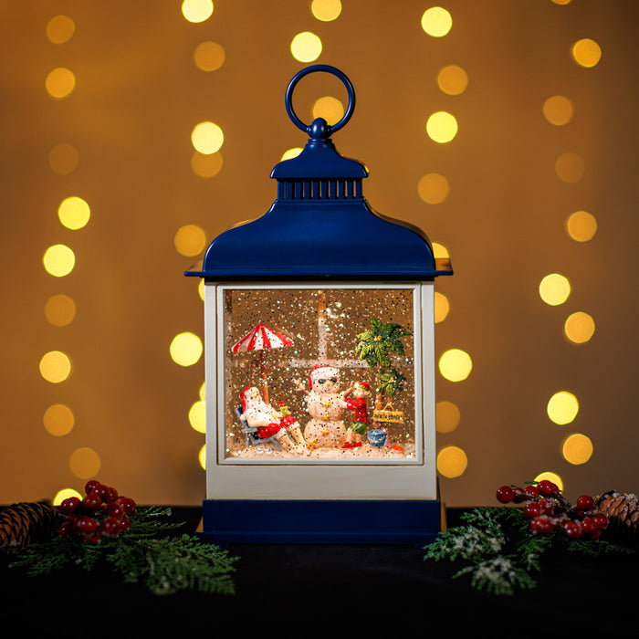 A Snowing Blue Hamptons Lantern w/ Santa on the Beach