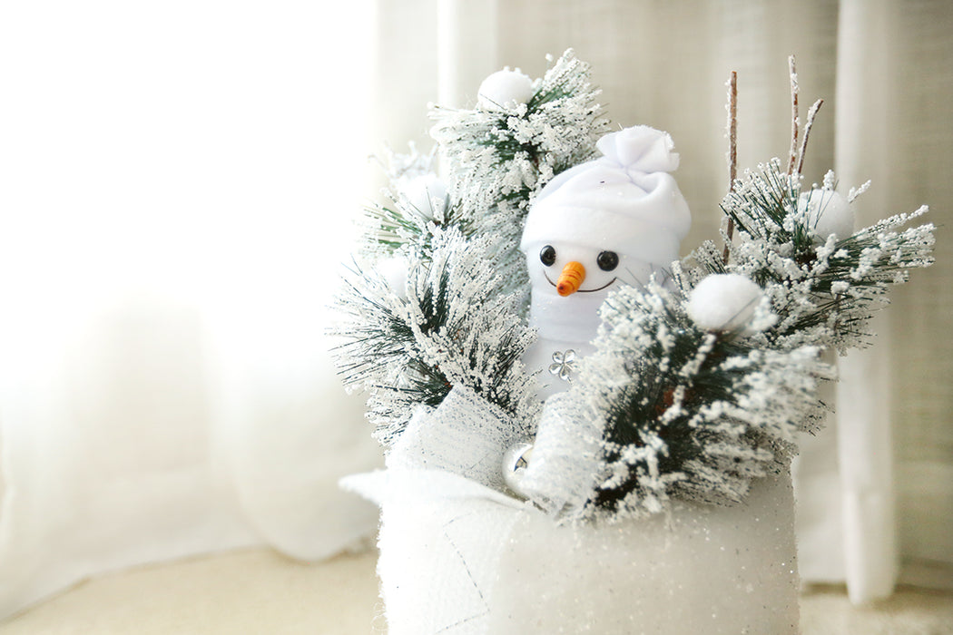 Large Snowman on Pillar