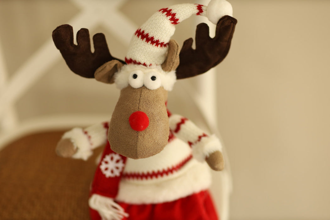 Sitting Reindeer with Red & White Sweater