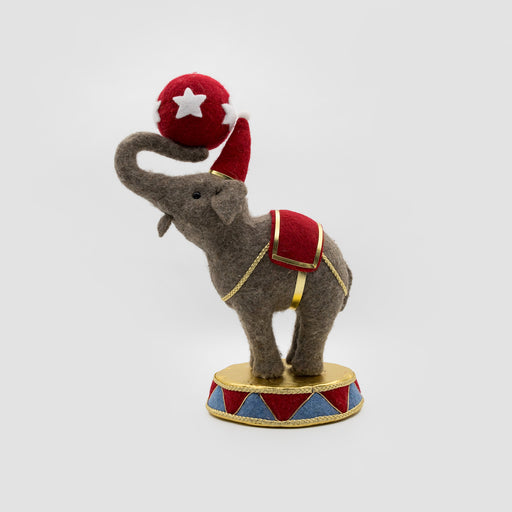 Felt circus elephant balancing a red star ball – front view