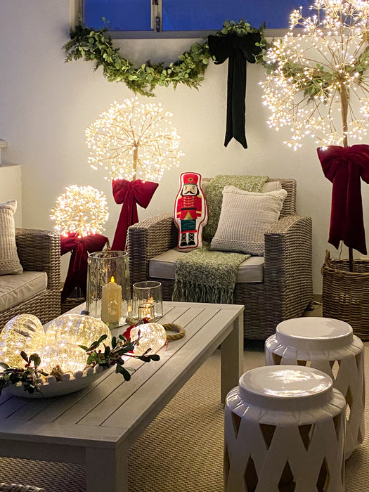 Dandelion light set of three creating a warm festive glow in a styled living room