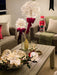 Dandelion lights glowing above an elegant Christmas table display