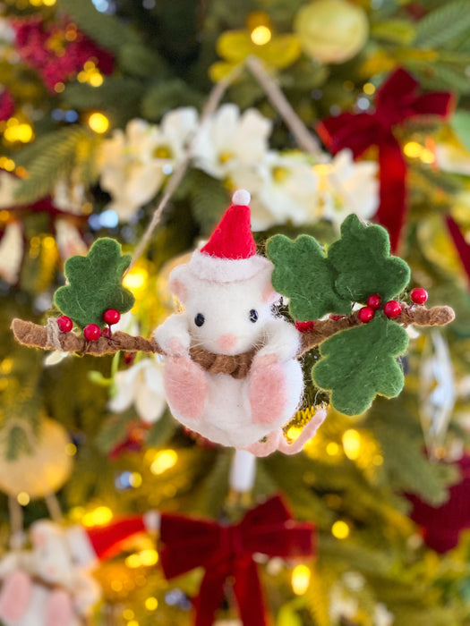 Close-up of a felt hanging mouse ornament with green leaves and red berries
