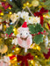 Close-up of a felt hanging mouse ornament with green leaves and red berries
