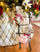 Felt cookie roll mouse and cake mouse climbing a rustic twig ladder