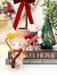Felt mouse postman styled with a felt leaf mouse and green glass Christmas tree