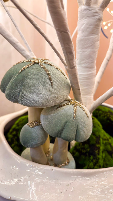 Sage velvet mushroom set styled beneath a white decorative tree