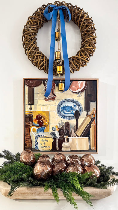 Brown mercury organic glass ball ornaments arranged with fresh Christmas greenery