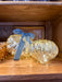 Illuminated mercury glass onion ornaments in coordinating sizes with a blue velvet bow