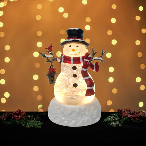 Illuminated snowman Christmas decoration with red scarf and lantern
