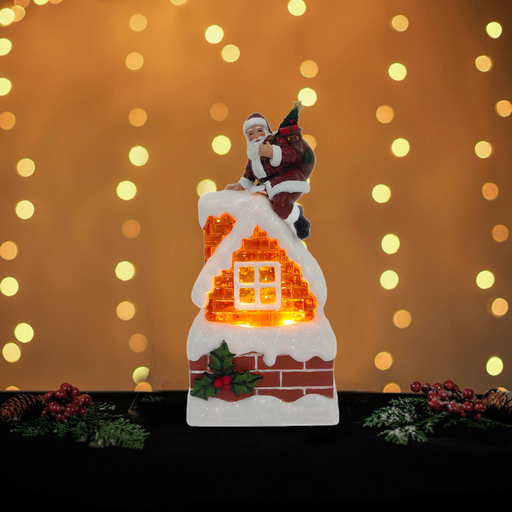 Santa on a snow-covered chimney light-up Christmas decoration