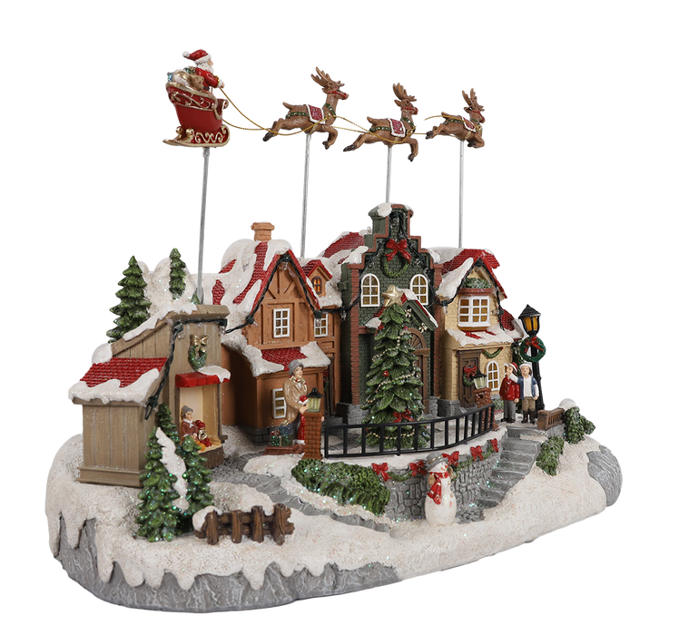 Animated Christmas village with Santa sleigh and reindeer – left angle