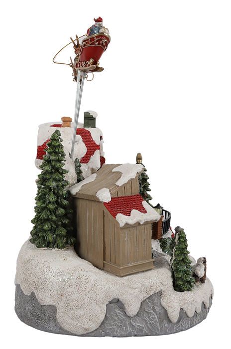 Animated Christmas village with Santa sleigh and reindeer – left side