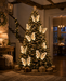 46cm fluttering butterfly lights on a warm Christmas tree – lifestyle view