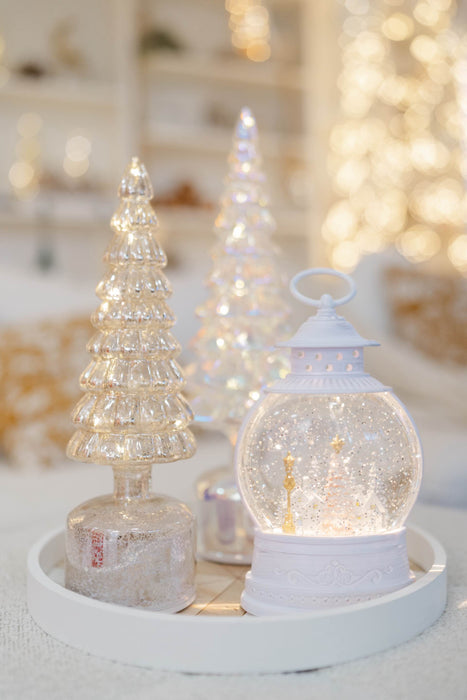 Mercury glass LED Christmas tree styled with a white Christmas lantern