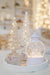 Mercury glass LED Christmas tree styled with a white Christmas lantern