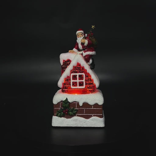 Snowing Petite Chimney with Santa illuminated Christmas decoration video