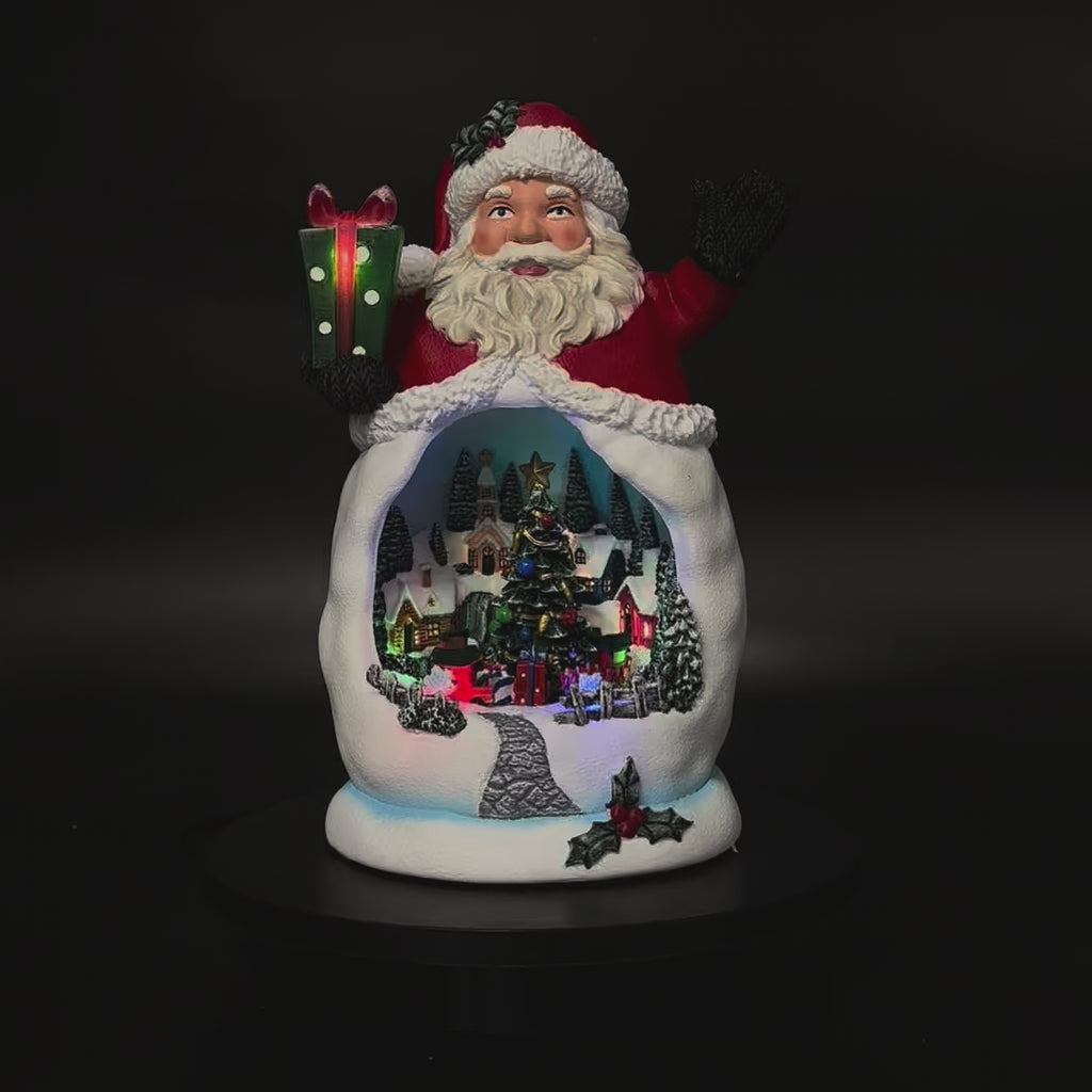 Animated Santa with rotating Christmas village in motion