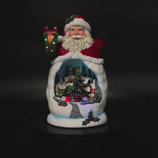 Animated Santa with rotating Christmas village in motion